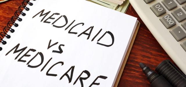 Book with text Medicaid Vs Medicare